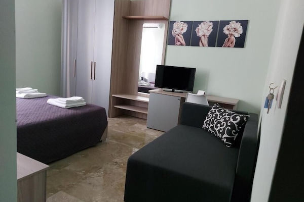 Chambre Triple, vue ville | 2 chambres, literie de qualité supérieure, couette en duvet d'oie