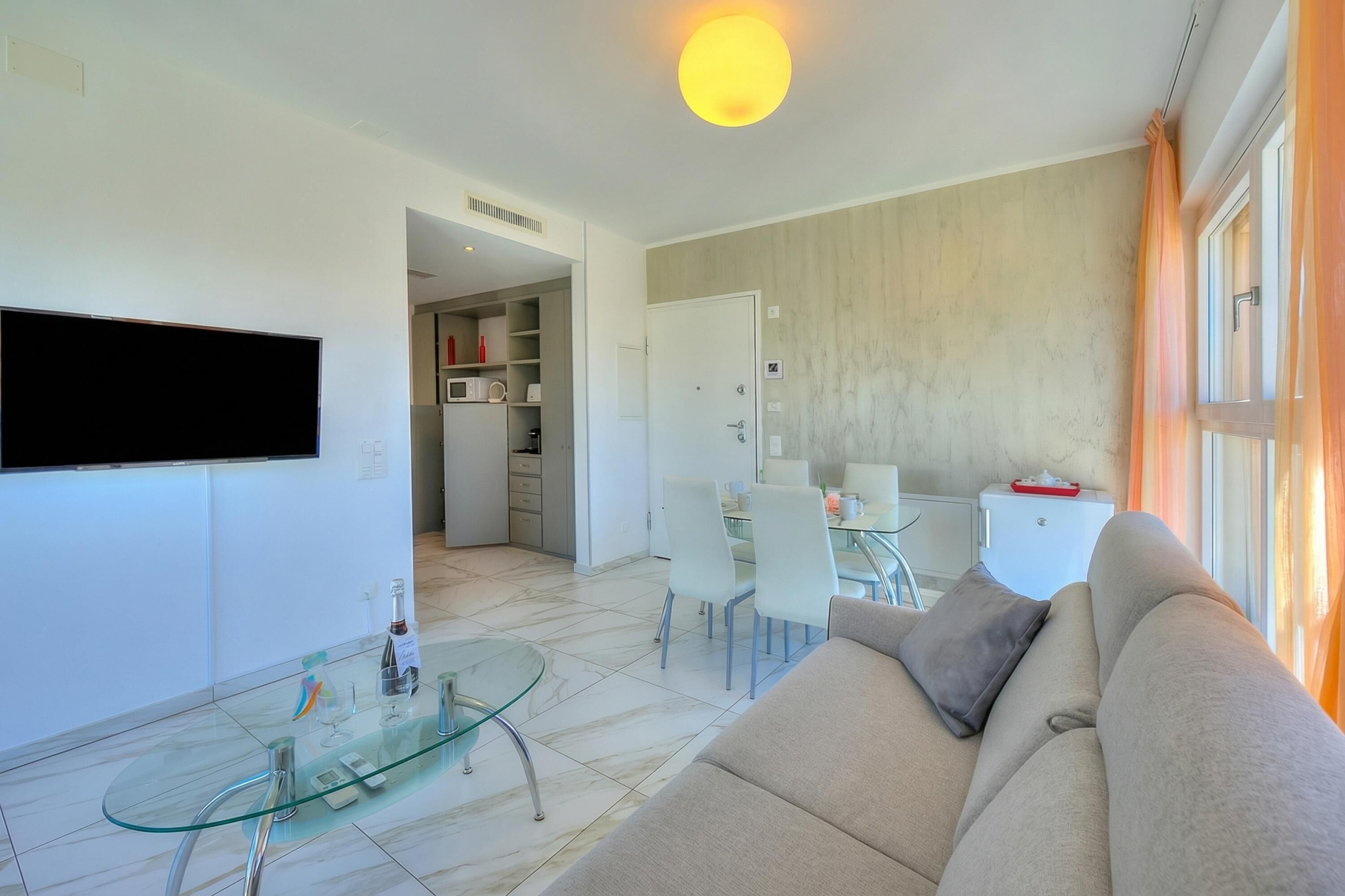 Standard Apartment, Multiple Bedrooms (Attico Al Parco with airconditioning) | Living area | 21-inch TV with cable channels