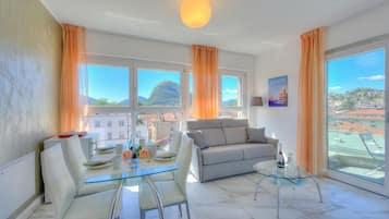 Standard Apartment, Multiple Bedrooms (Attico Al Parco with airconditioning) | Living area | 21-inch TV with cable channels