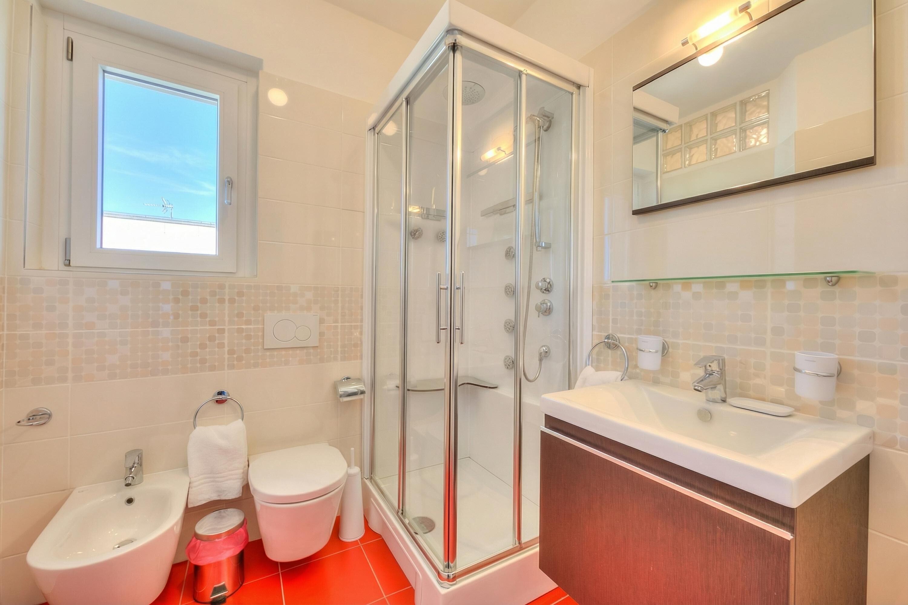 Standard Apartment, Multiple Bedrooms (Attico Al Parco with airconditioning) | Bathroom | Shower, hair dryer, bidet, towels