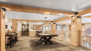 A pool table in a wooden-floored room with a long corridor and a stone wall. - 1 Minute Walk to the Super Bee Chair! Enjoy the Best of Copper from this Beautif (Frisco)