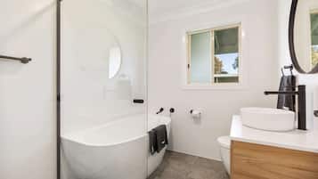 Bathtub, hair dryer, towels, soap