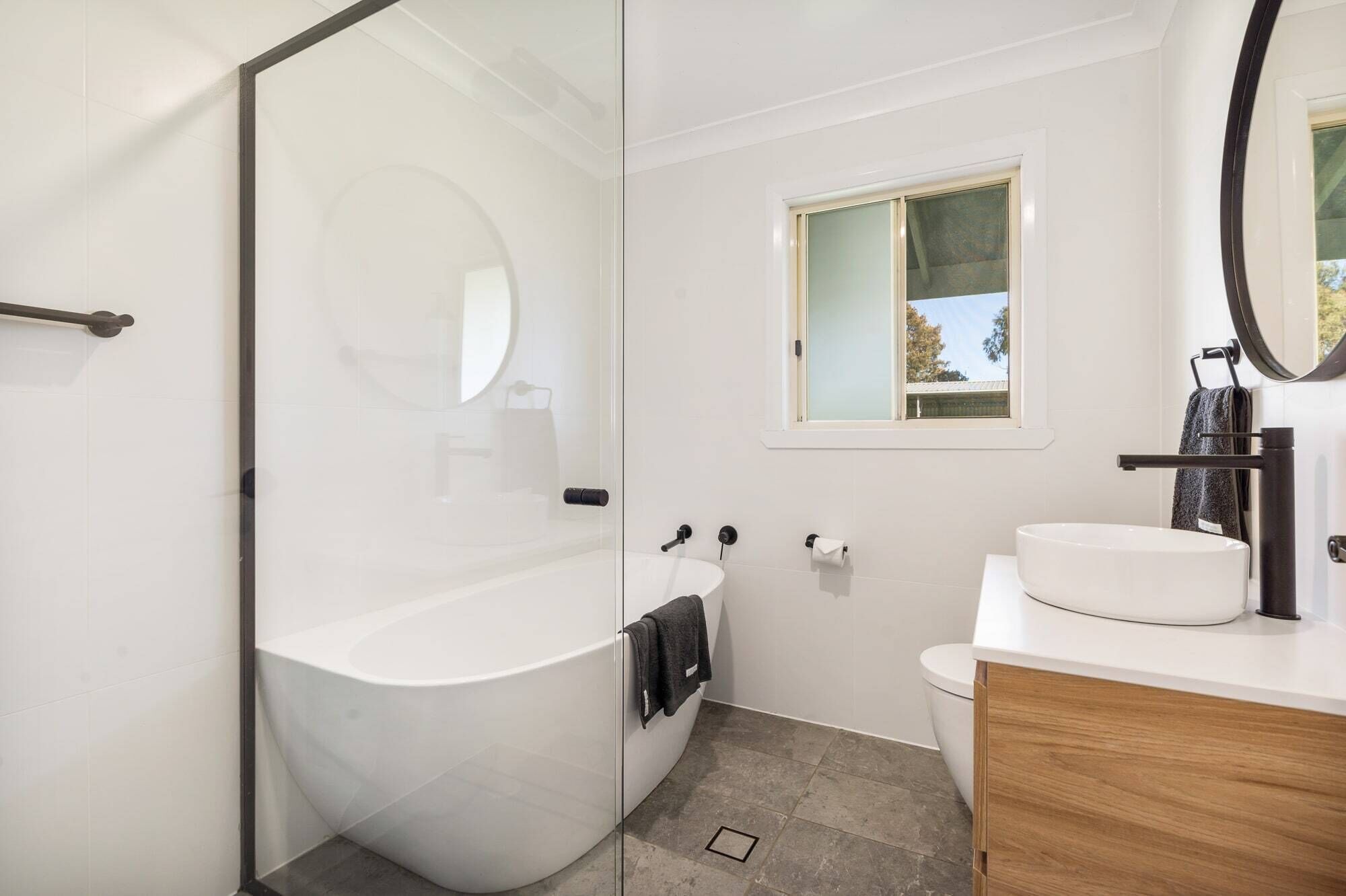 Bathtub, hair dryer, towels, soap