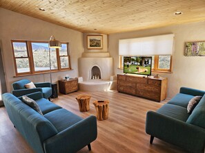 TV, fireplace, table football - Luxury Adobe Gem - Epic Mountain Views, Hot Tub, Foosball, Loft (El Prado, Taos)