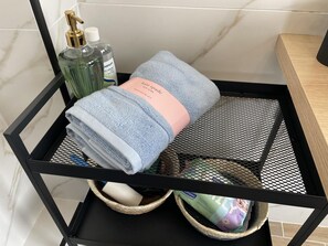 Shower, hair dryer, towels