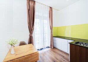 Family Room, Balcony | Private kitchen | Shared fridge, stovetop, cookware/dishes/utensils, spices - Dalat Blanc Hotel & Apartment (Da Lat)