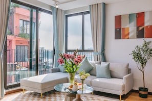 Apartament panoràmic | Sala d'estar | Televisor de pantalla plana