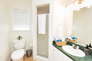Shower, hair dryer, towels, soap