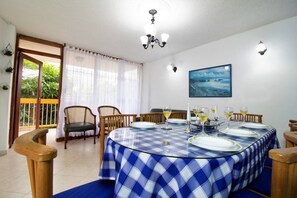 Apartamento, 3 quartos | Sala de jantar