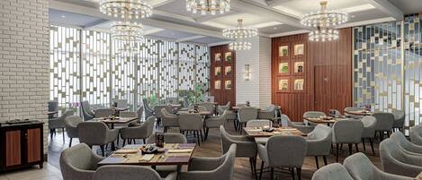 A modern dining area with multiple tables and chairs, elegant chandeliers, and a mix of brick and wooden walls.