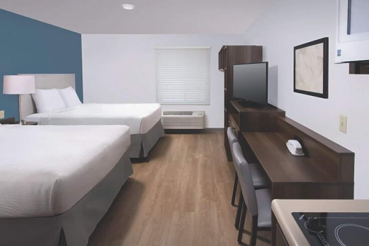 Premium bedding, individually furnished, desk, laptop workspace