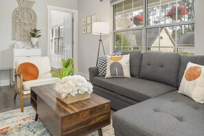 Smart TV, fireplace, books, computer monitors