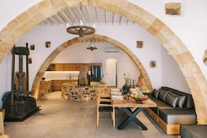 Traditional Villa | Living area | 55-inch flat-screen TV with satellite channels - Kalathos Square Luxury Suites (Rhodes)