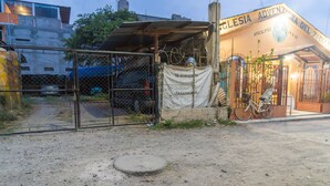 A building with a sign reading "Adventista del 7º Día." - Atitlans House  (Panajachel)