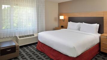Hypo-allergenic bedding, down duvets, desk, laptop workspace