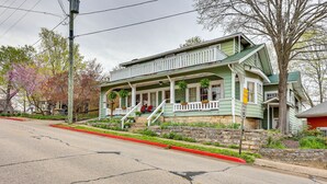 A two-story house with a porch, stone steps, and a street view. - Eureka Springs Vacation Rental < Half-Mi to Dtwn! (Eureka Springs)