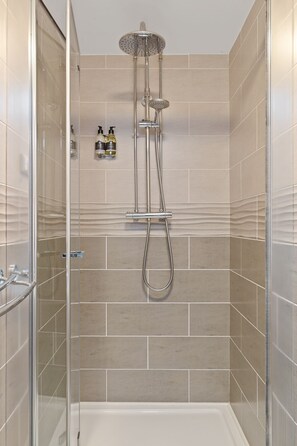 Shower, hair dryer, towels, soap