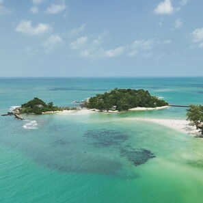 An aerial view of a tropical island with clear turquoise waters, sandy beaches, and dense green vegetation. - Luxury private 3 Ultra-King BR, with staff, villa sea view 10min walk to beach (Surat Thani)