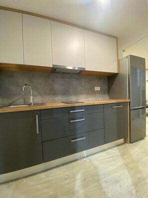 Private kitchen - Pretty Green - your vacation oasis in the green, right on the beach (Drage)