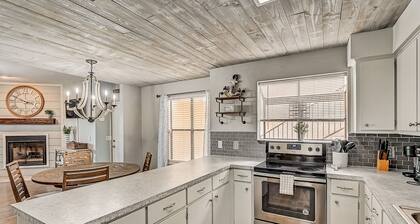 Dog-friendly water view condo with inviting porch, AC, W/D, & modern charm