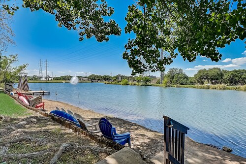 Dog-friendly water view condo with inviting porch, AC, W/D, & modern charm