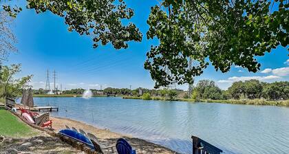 Dog-friendly water view condo with inviting porch, AC, W/D, & modern charm