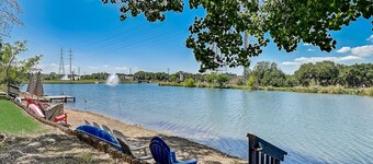 Dog-friendly water view condo with inviting porch, AC, W/D, & modern charm
