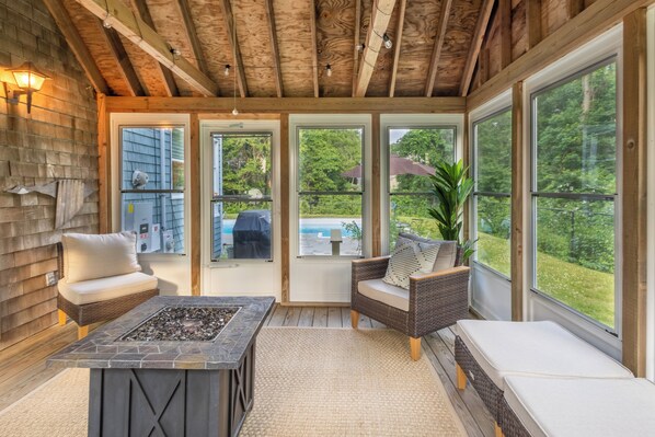 Relax in a serene outdoor space with a seating area and views of lush greenery.