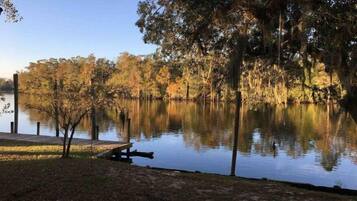 Enjoy a serene lakeside retreat with a dock and picnic table.