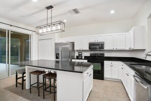Fridge, microwave, oven, stovetop - Magical Themed 7BR 10 mins to Disney 🌴 Theater, Pool, Spa + Resort Amenities! (Kissimmee)
