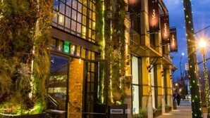 A building with a vertical garden and illuminated signage. - Large home - Sleeps many 4B/2B (Walnut Creek)