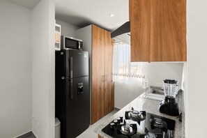 Fridge, microwave, stovetop, coffee/tea maker