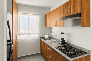 Fridge, microwave, stovetop, coffee/tea maker