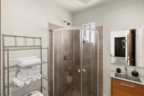 Shower, hair dryer, towels, soap