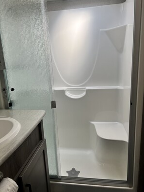 Shower, hair dryer, towels, soap