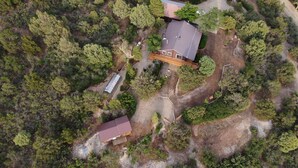 An aerial view of a property with a main house and a smaller building, surrounded by dense forest. - Private Sauna and Stunning Views of Mesa Verde, Walk to Mancos State Park (Mancos)
