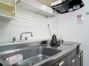 Fridge, microwave, cookware/dishes/utensils
