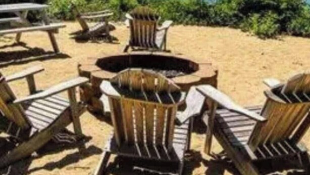 Outdoor seating with a fire pit, a view of a lake, and a picnic table. - Luxury Resort with Restaurants , 5 minutes to the beach (West Yarmouth)