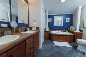 A bathroom with two sinks, a large mirror, and a toilet. - Private, Updated Baileys Harbor Home: The Roost (Baileys Harbor)