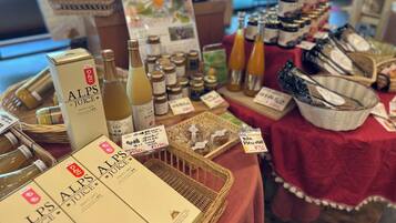 A display of ALPS juice boxes and bottles on a table with price tags.