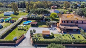A residential area with a large house, swimming pool, and surrounding greenery. - La Casina by Interhome (Cecina)