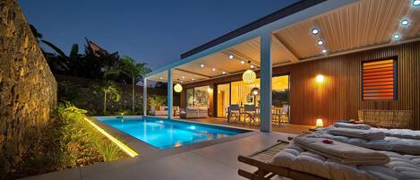 A heated pool, pool loungers