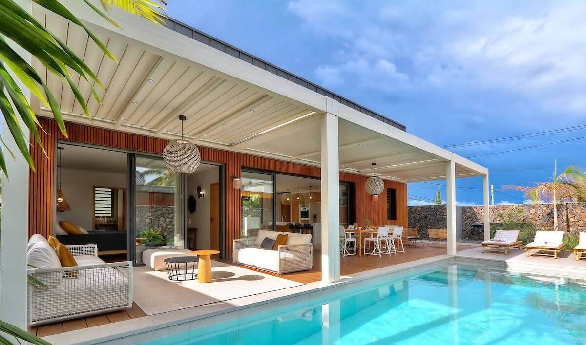 A heated pool, sun loungers