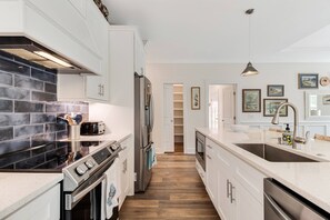 Fridge, microwave, stovetop, dishwasher - Wonderful New Dog Friendly Home with Hot Tub, Golf Cart and Screened In Porch, Easy Access to Beach (Oak Island)