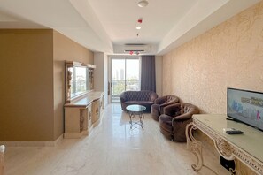 Living room - Nice 3Br Connected To Mall At Grand Sungkono Lagoon Apartment (Surabaya)