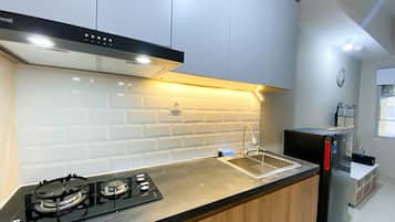 Apartment | Private kitchen | Full-size fridge, stovetop