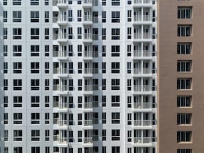 Stylish residential building with a grid of windows and balconies.