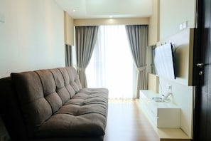 Apartamento, 2 quartos | Área de estar