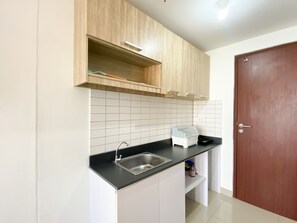 Apartment | Private kitchen | Full-size fridge, stovetop - Compact And Comfortable Studio Sayana Bekasi Apartment (Tarumajaya)