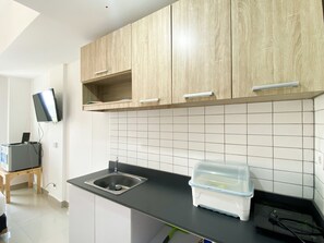 Apartment | Private kitchen | Full-size fridge, stovetop - Compact And Comfortable Studio Sayana Bekasi Apartment (Tarumajaya)